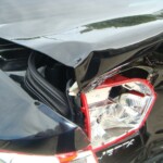 Before and after photographs of a damaged black Volkswagon Jetta that was repaired by Elite Paint & Body Shop in West Palm Beach, Florida.